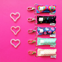 Load image into Gallery viewer, Rainbow Hearts on Pink LippyClip®