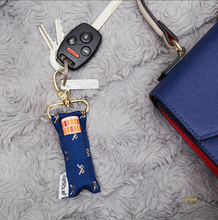 Load image into Gallery viewer, Gold Bows on Navy LippyClip® Lip Balm Holder