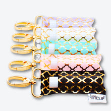 Load image into Gallery viewer, Gold Quatrefoil on White LippyClip® Lip Balm Holder