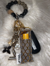 Load image into Gallery viewer, Gold Quatrefoil on Charcoal LippyClip® Lip Balm Holder