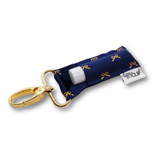 Load image into Gallery viewer, Gold Bows on Navy LippyClip® Lip Balm Holder
