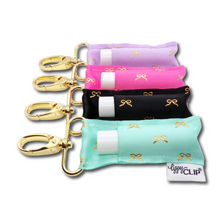 Load image into Gallery viewer, Gold Bows on Blue LippyClip® Lip Balm Holder