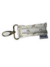 Load image into Gallery viewer, Gold Bows on Ivory LippyClip® Lip Balm Holder
