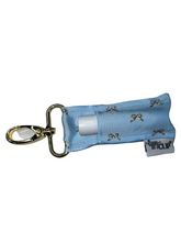 Load image into Gallery viewer, Gold Bows on Blue LippyClip® Lip Balm Holder